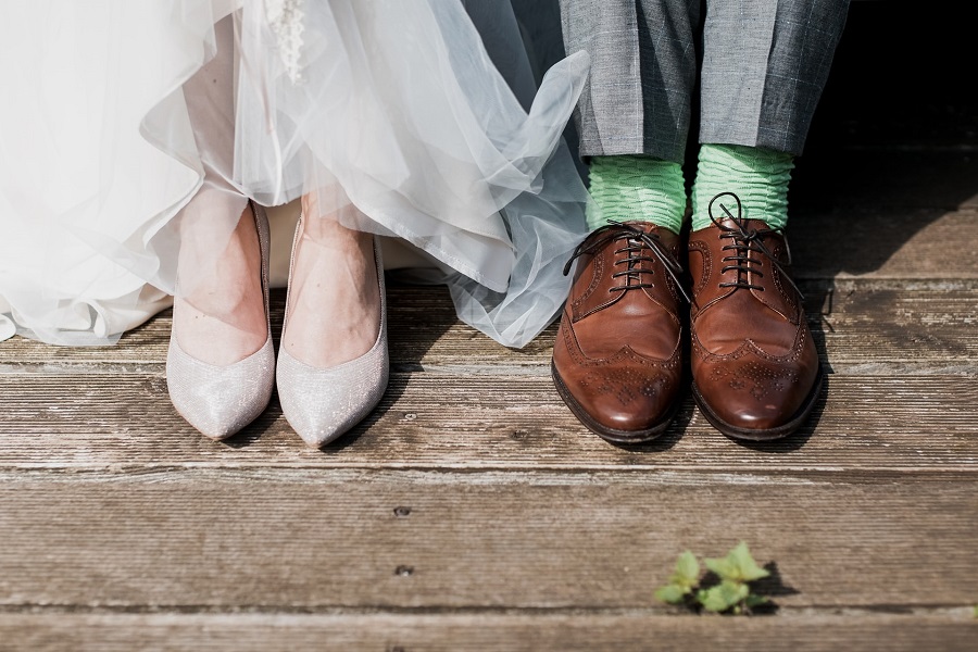 Couple Standing on Brown Wooden Floor