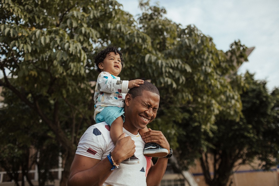 Man Carrying Child