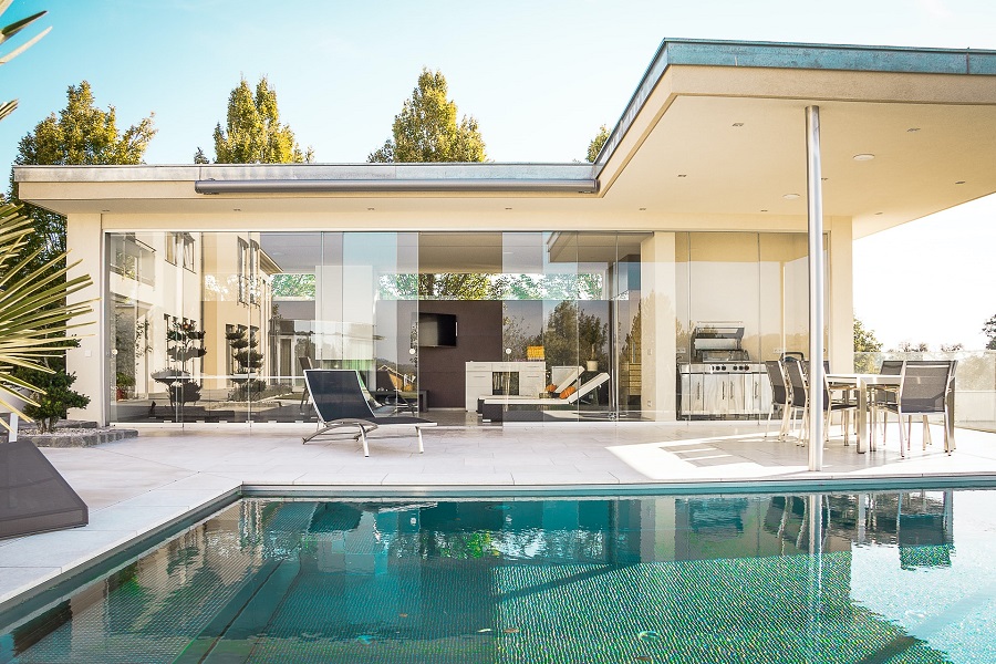 A contemporary white and concrete house with swimming pool